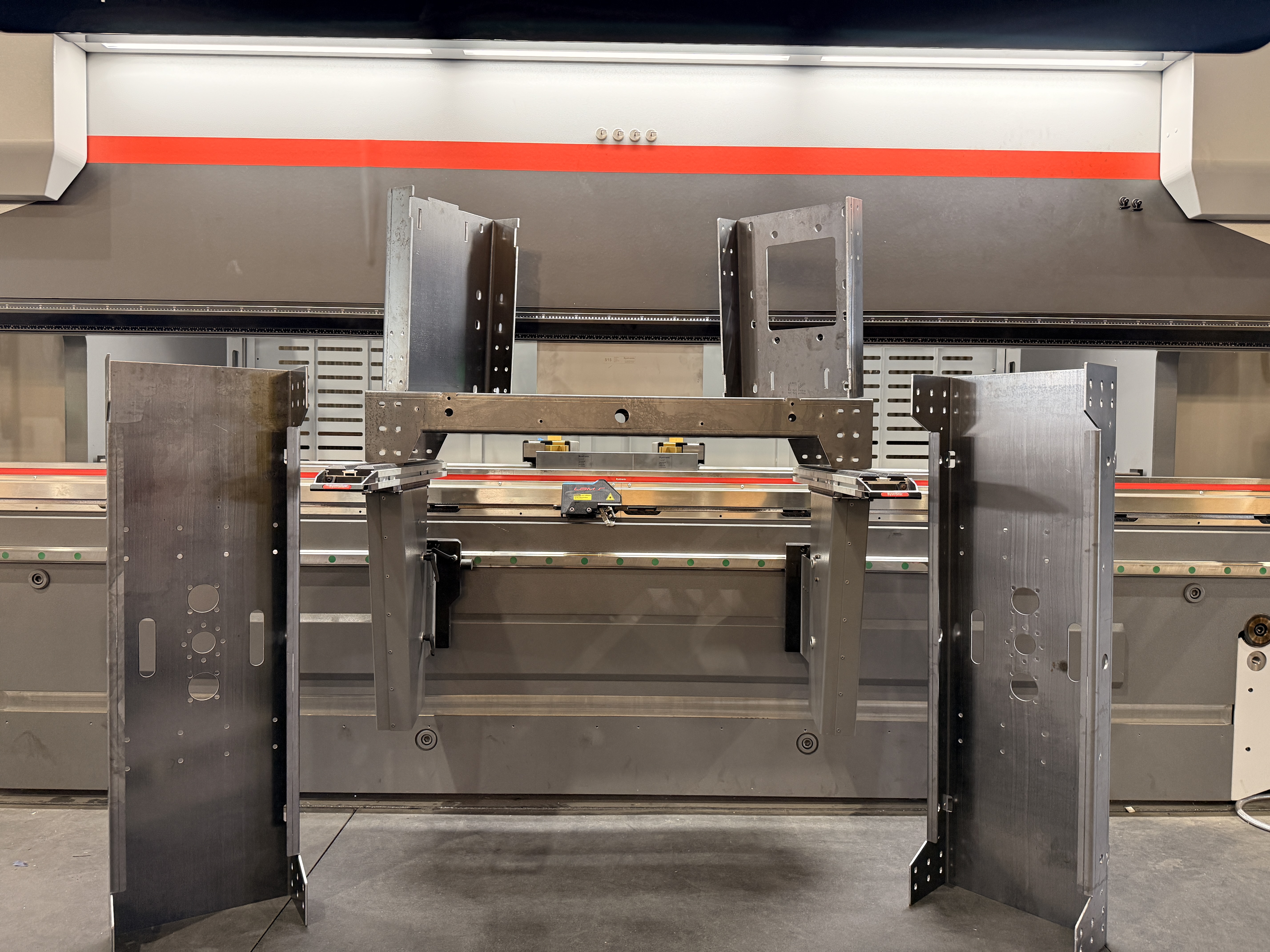 Formed sheet metal components displayed at the press brake